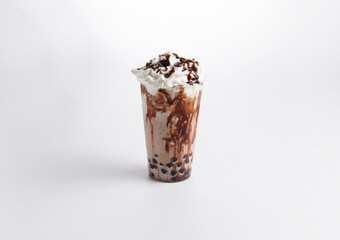 Milkshake with chocolate syrup and whipped cream in a glass. on a white background.