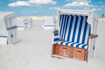 Strandkörbe sun loungers on the northern Germany St. Petersburg - Ording on the shore of the North Sea on the beach for relaxation