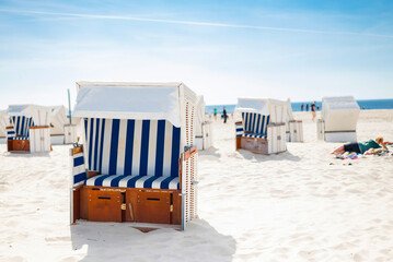 Strandkörbe sun loungers on the northern Germany St. Petersburg - Ording on the shore of the North Sea on the beach for relaxation