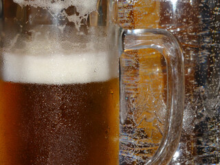 Full Glass of Beer in front of a Full Plastic Bottle of Sprinkled Water. Alcohol and Non-Alcohol Beverages Assortment Stock Image
