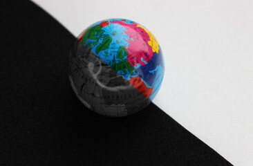 African Continent on Small Earth Model Divided with Straight Line on Colored and Grayscale Parts....