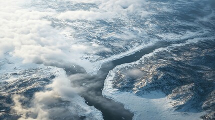 Aerial View of a Frozen River Winding Through a Snowy Landscape
