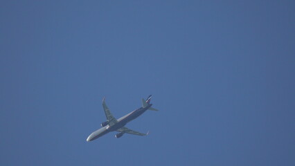 Airplane Flight Sky: Commercial Jet Airliner Ascending Clear Blue Sky Daytime Travel