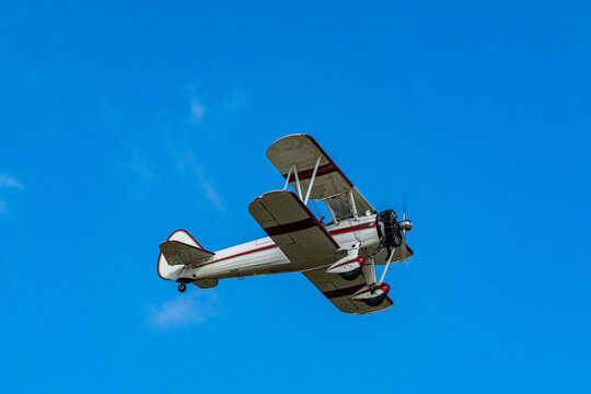 Vintage Boeing Stearman PT-17 Kaydet flying over Cuatro Vientos Airport in Madrid, Spain