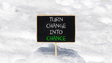 Turn change into chance symbol. Concept words phrase Turn change into chance on beautiful black...