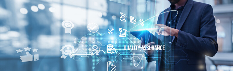 A businessman uses a tablet to analyze Quality Assurance and business growth strategies to enhance competitiveness, customer base. Quality Assurance ensures consistent product and service quality.