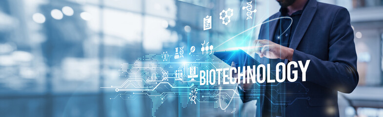Biotechnology. A businessman using a tablet analyzing biotechnology and market growth highlights rapid advances in gene therapy, biologics, and AI driving the biotech industry's global expansion.