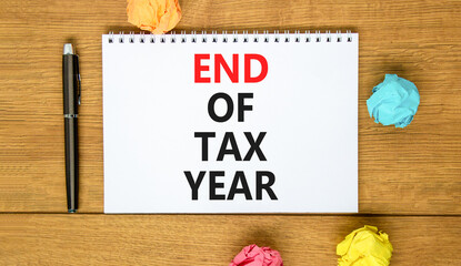 End of tax year symbol. Concept words phrase End of tax year on beautiful white note. Colored...