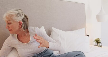 Senior woman smiling while video chatting on smartphone in cozy bedroom, at home - Powered by Adobe