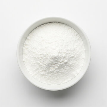 Ultra-fine starch powder in white ceramic bowl isolated on white background
