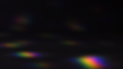 Abstract background with overlapping, iridescent lens flare effects in rainbow colors on a dark...