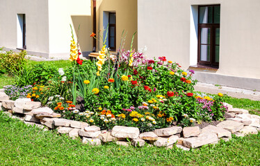 Beautiful flower bed with various plants and flowers