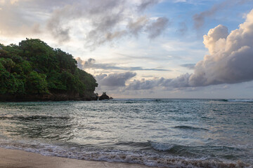 Nature vacation background, sunset at Padang Padang Beach in Bali Indonesia