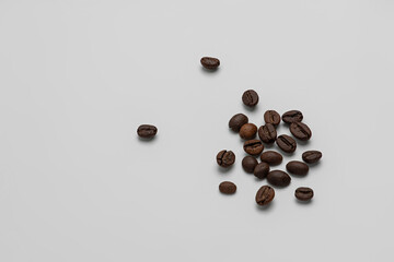 Coffee beans on gray lying on gray background