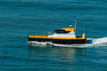 Pilot Boat Sailing Through Blue Sea