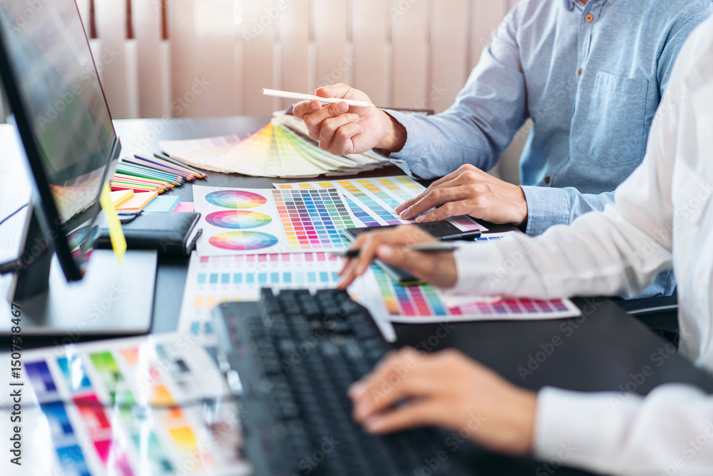 Aufkleber two creative graphic designer team working on color selection and drawing on graphic tablet, color s