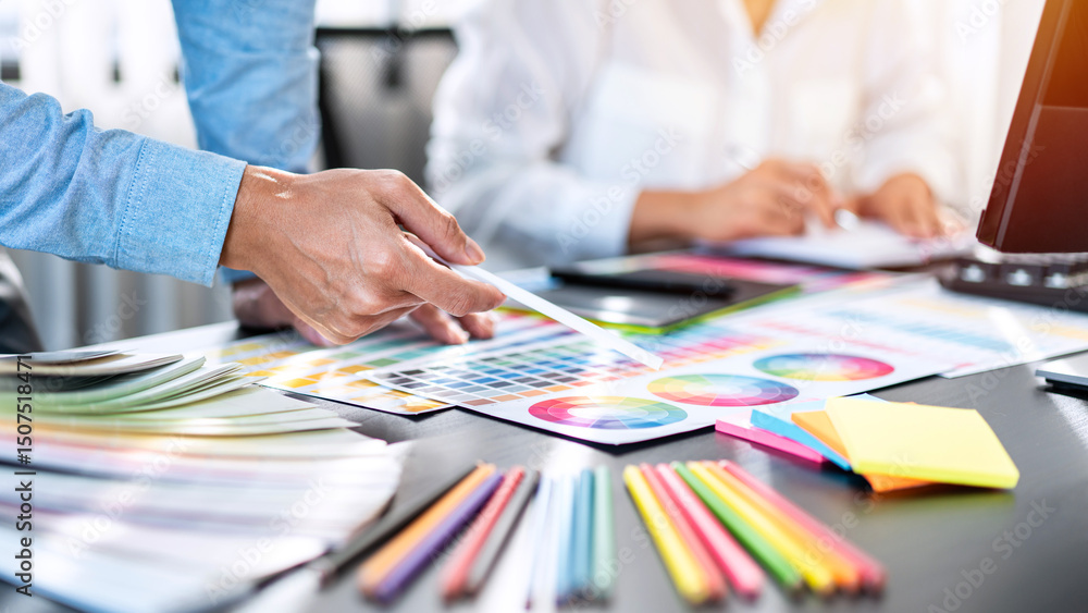 Poster Team of creative graphic designer working on color swatch samples chart for selection coloring in inspiration to create new collection at workplace