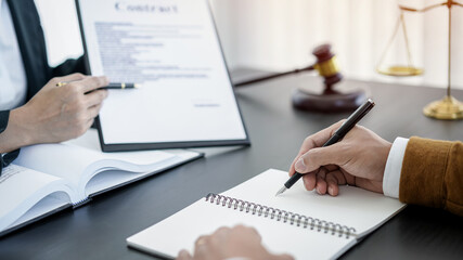 Male lawyer or notary working consulting and discussion to businesswoman client in the office, Law and Legal services concept