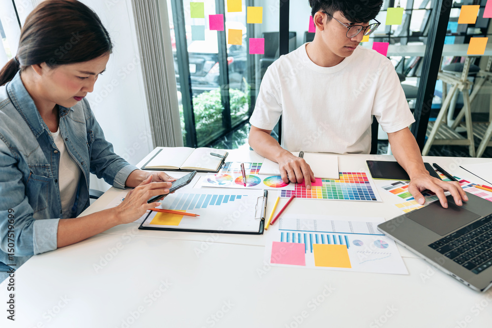 Poster Team of creative graphic designer working on color swatch samples chart for selection coloring in inspiration to create new collection at workplace
