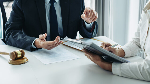 Male lawyer or notary working consulting and discussion to businesswoman client in the office, Law and Legal services concept