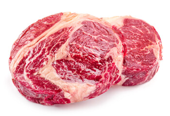 Obraz premium Raw ribeye steaks isolated on white background.