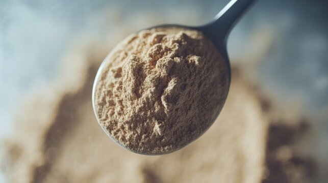 Close-up of whey protein powder in stainless steel
