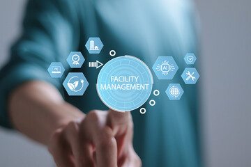 Facility management concept. Building resource management covers activities related to buildings or various locations. Person touching facility management icon on virtual screen.