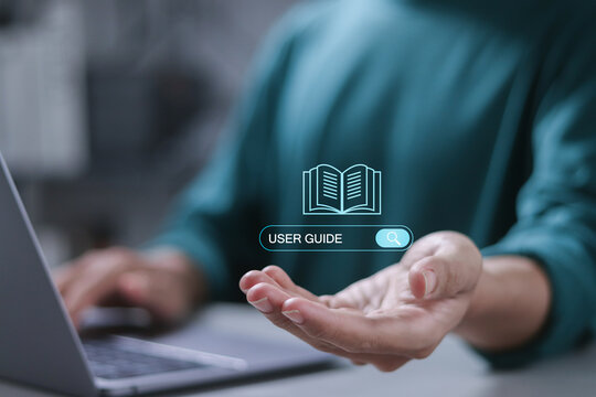 User manual guide, Online instruction manual and strategy advice. Businessman using laptop to searching user guide for business service.