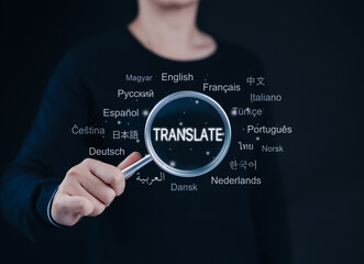 Translation and Multilingual Communication Concept. A person holds magnifying glass focus on word 