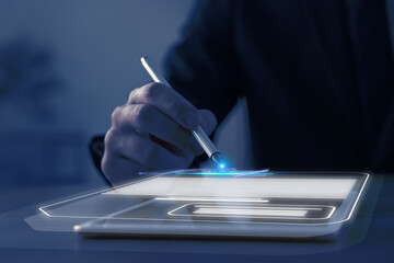 Man signing electronic document with stylus pen on virtual screen above tablet computer, closeup