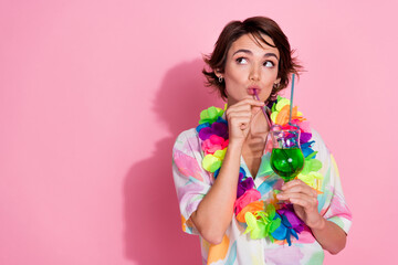 Portrait of nice young lady sip cocktail look empty space wear shirt isolated on pink color...