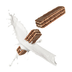 Tasty crispy wafers and splashing milk on white background