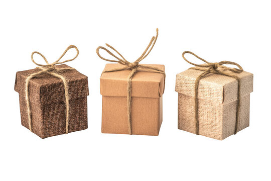 Three wrapped gifts with twine on white background on transparent background