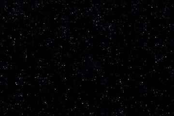 Starry night sky. Dark blue galaxy space background. Glowing stars in space. New Year, Christmas and Celebration background concept.
