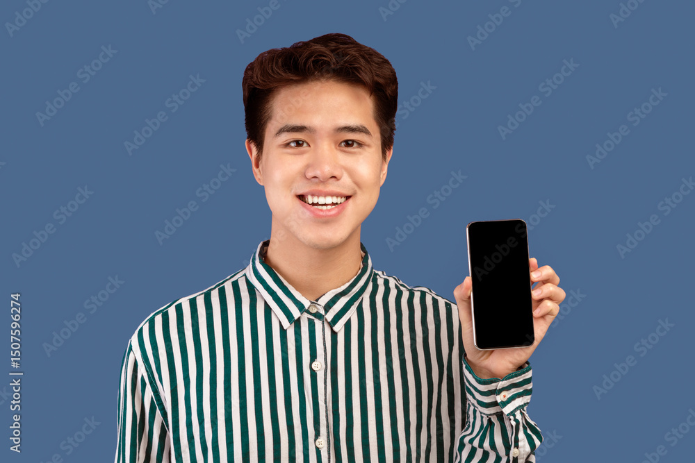 Aufkleber i recommend this website. smiling young asian man holding smartphone with black empty screen in hand