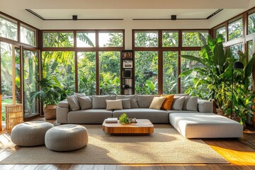 Sunlit modern living room with large windows and cozy beige sofa