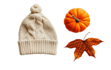 Warm fall knit hat featuring leaf pattern next to seasonal pumpkin decor Isolated on Transparent Background PNG