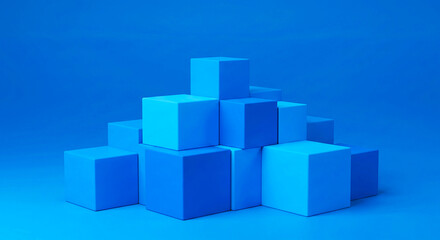 Naklejka premium A stack of blue cubes arranged in a pyramid shape against a solid blue background in a studio setting
