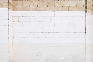 front view of white painted brick wall of house