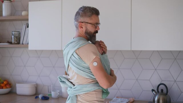 Father comforting his crying baby son.