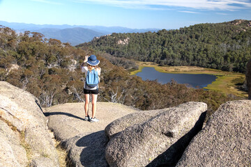 Caucasian Woman Hiking by Lake Catani in Mount Buffalo National Park, Victoria, Australia