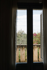 View from the old Italian balcony with shutters. 