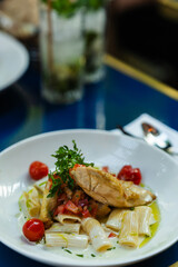 Fresh pasta dish with grilled chicken. Suitable for restaurant menu, food blog, or culinary website illustration.