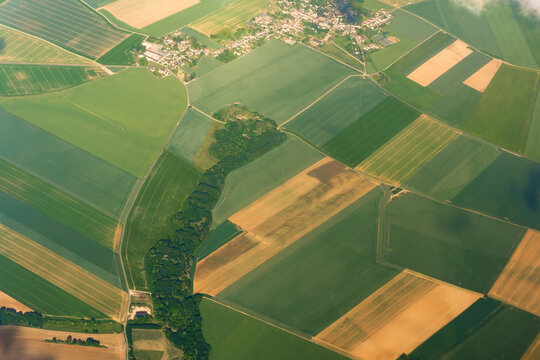Aerial View of farmland landscape for agricultural planning and rural development. Useful for illustrating crop distribution and land management concepts.