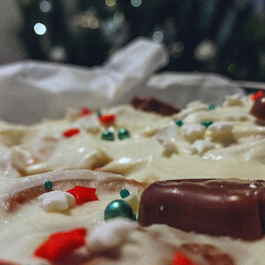 Christmas cake with cream and candies in the form of a heart