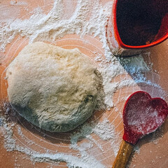 Flour and rolling pin on the table. Selective focus. Toned.