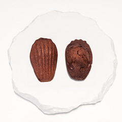 Elegant French Madeleines and Financiers on White Marble Plate in a Premium Dessert Cafe