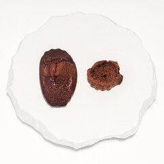 Elegant French Madeleines and Financiers on White Marble Plate in a Premium Dessert Cafe