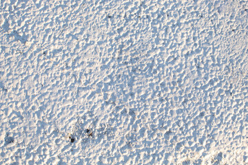 Close-up of a freshly painted white section of a pedestrian crossing. Creative background