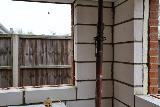 Home improvement, Wall Installation, insolation blocks, construction materials, broken window on old house, restoration close up 